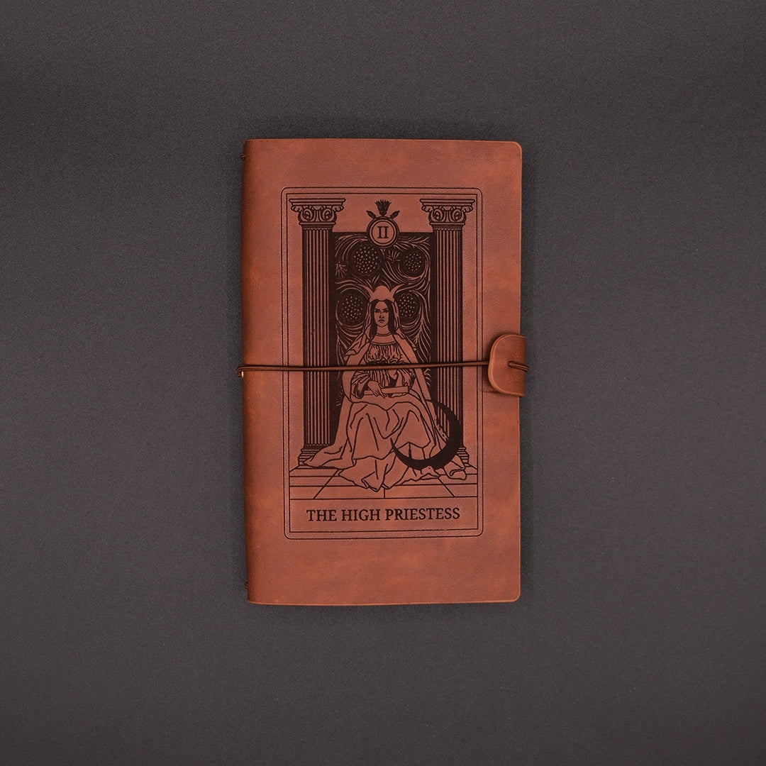 Brown, vegan leather Products High Priestess Vintage Diary over the black background.