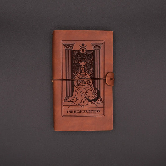 Brown, vegan leather Products High Priestess Vintage Diary over the black background.