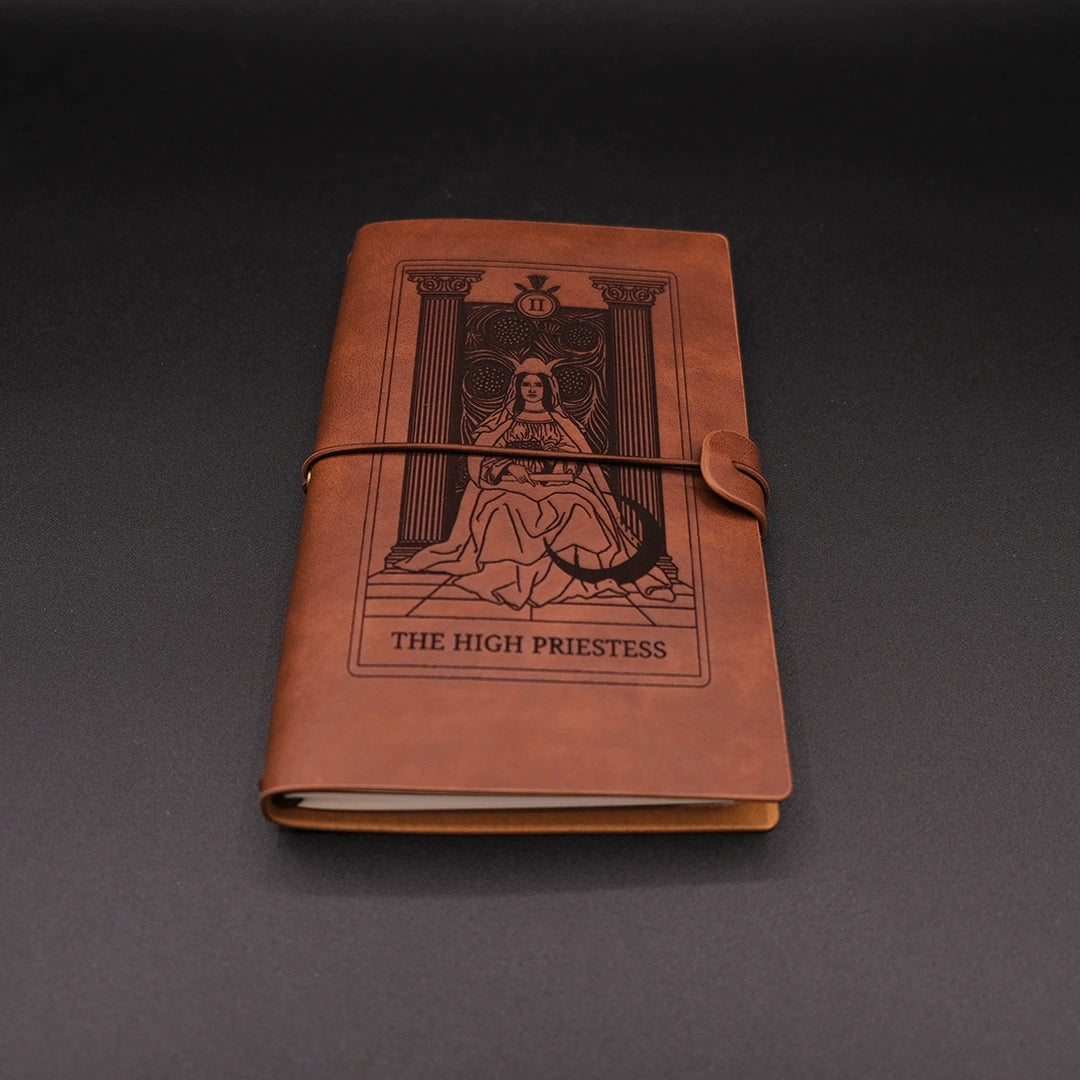 Brown, vegan leather Products High Priestess Vintage Diary over the black background.