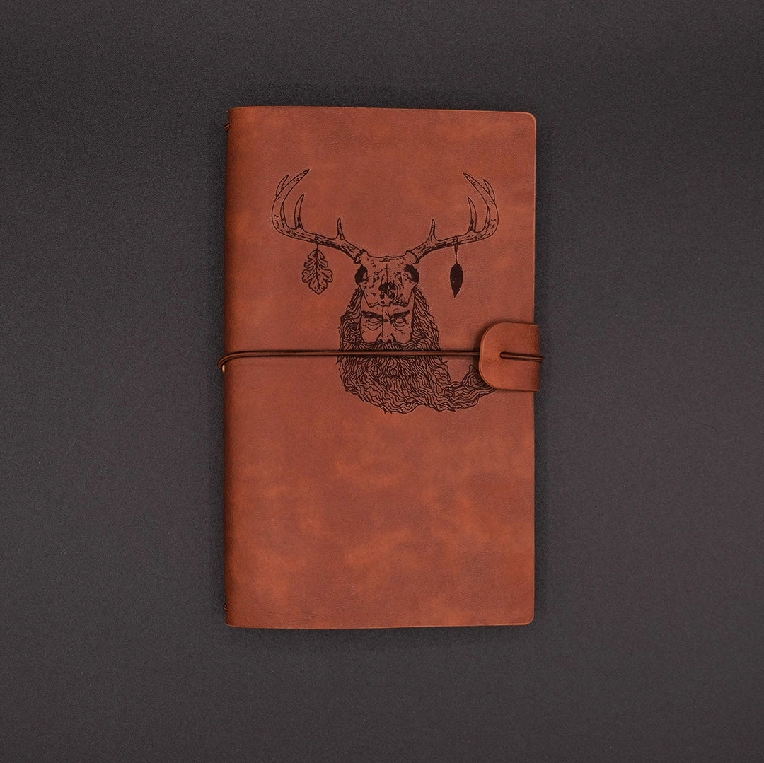 A vintage vegan leather diary engraved with a mystic lesnik from slavic mythology
