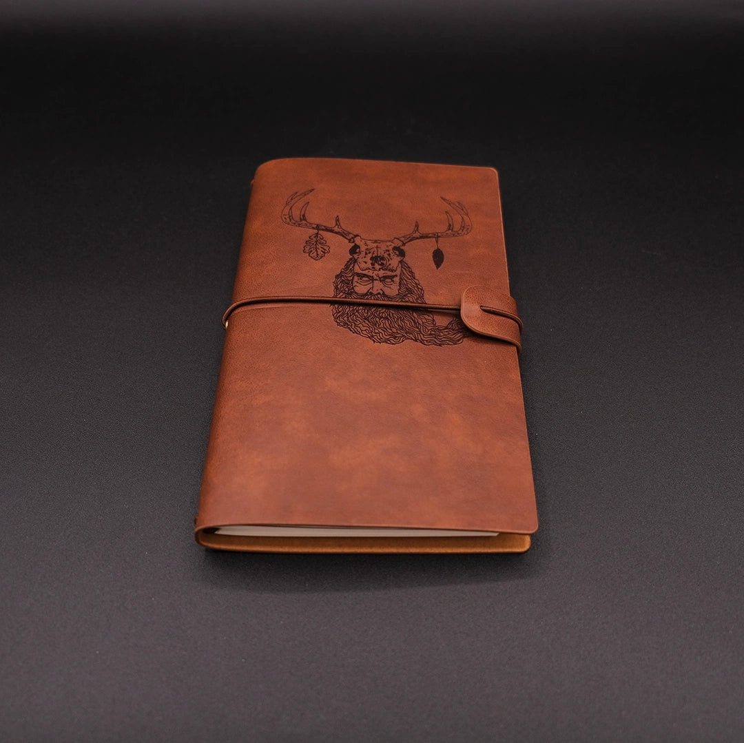 A vintage vegan leather diary engraved with a mystic lesnik from slavic mythology