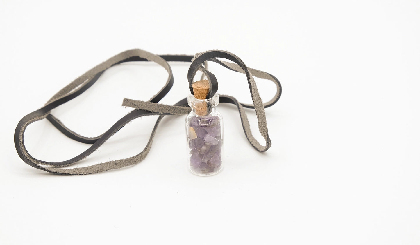 pendant made with a little glass bottle filled with amethyst shards