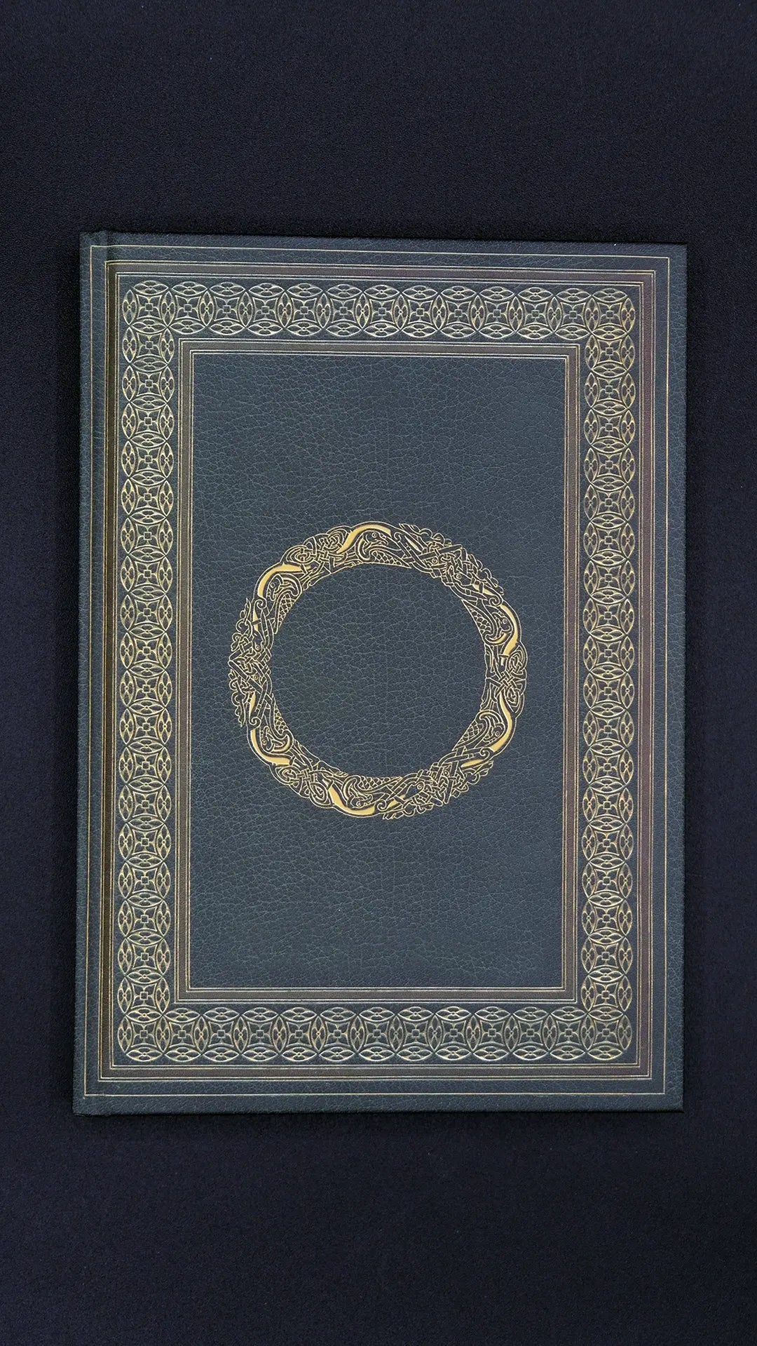 Dark green ornamented Journal Celtic over the black background.