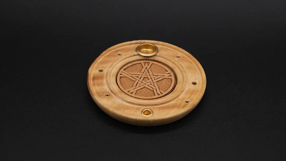 Round Pentacle Incense Burner made of wood on the black background.