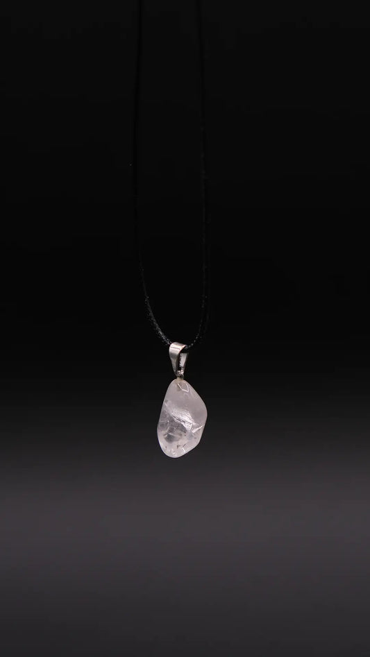 White Quartz Pendant over the black background.