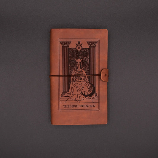 Brown, vegan leather Products High Priestess Vintage Diary over the black background.