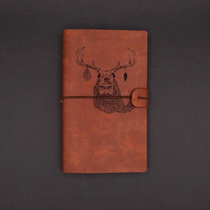 A vintage vegan leather diary engraved with a mystic lesnik from slavic mythology