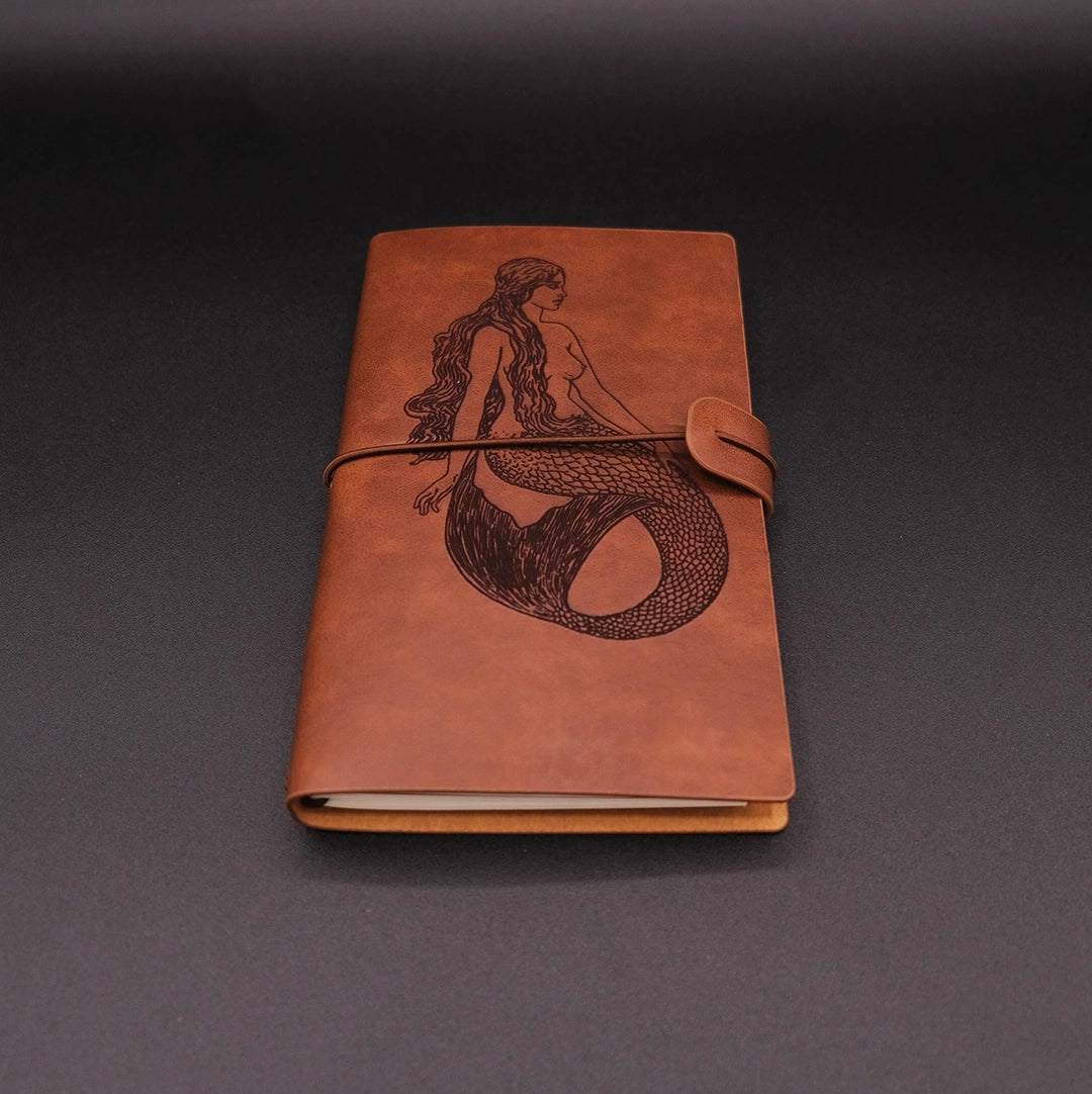 A vintage vegan leather diary engraved with a beautiful mermaid coming from the folklore