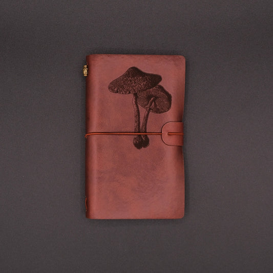 A vegan leather diary with a mushroom engraving, Front view