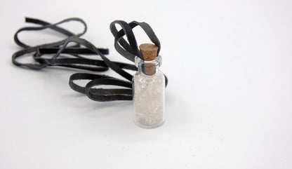 pendant made with a little glass bottle filled with white quartz shards