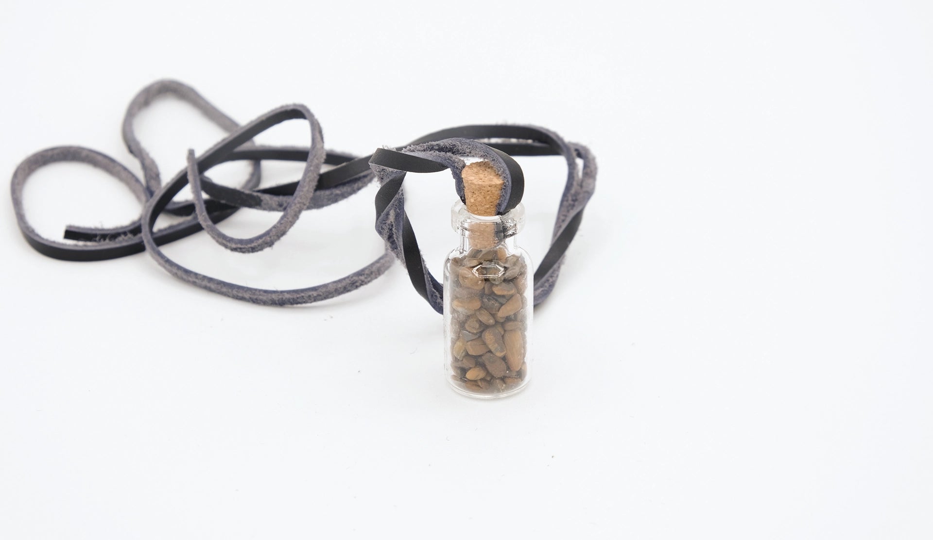 pendant made with a little glass bottle filled with tiger's eye shards