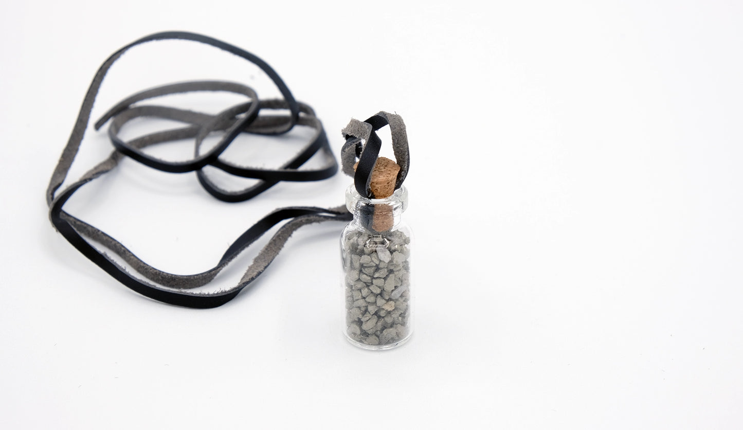 pendant made with a little glass bottle filled with pyrite shards