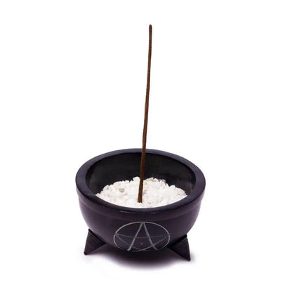 Cup in black steatite with a pentacle decoration, filled with little white stones and a stick of incense