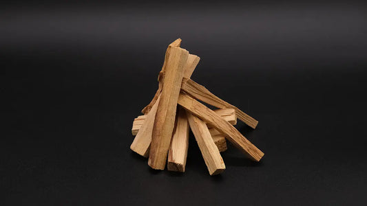 Wooden pieces of Palo Santo Wood on the black background.