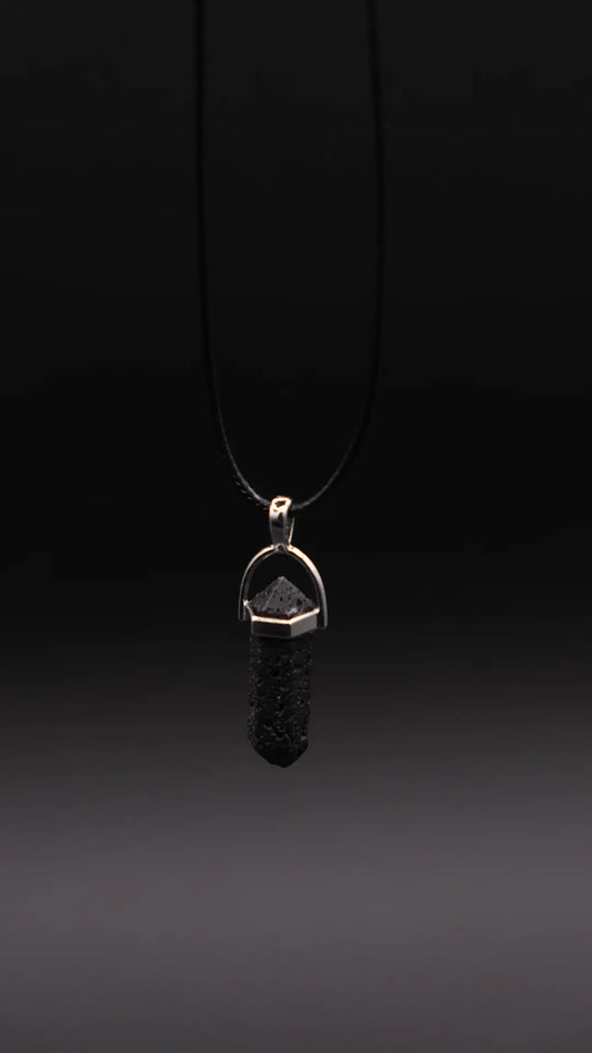 Prism Pendant  made from Lava Stone on the black background.