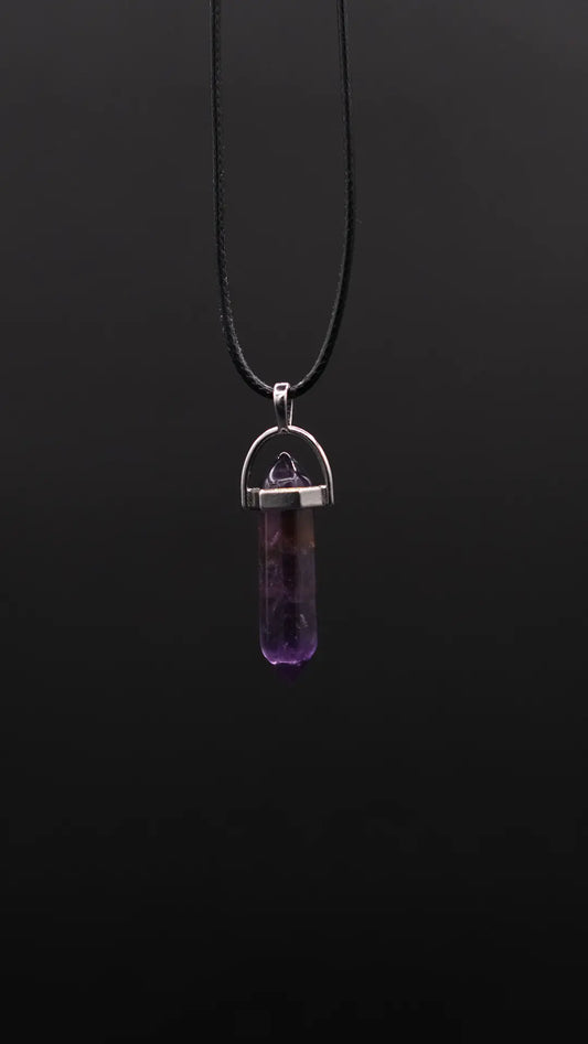 Prism Pendant  made from Amethyst on the black background.