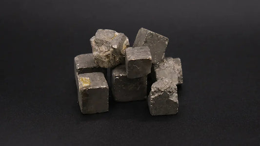 A composition of Pyrite cubes on the black background.